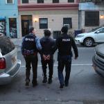 police arresting immigrant