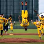 Players on a field jumping up and down celebrating