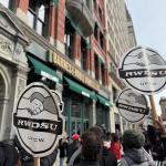 People rallying in front of a Barnes and Noble Store with RWDSU signs.m 