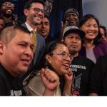 Photo of smiling people celebrating. 