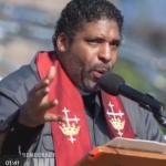 Rev William Barber speaking at a podium