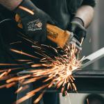 fire shooting out as a welder welds.