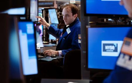 Photo of a trader at work on the floor of the New York Stock Exchange. 