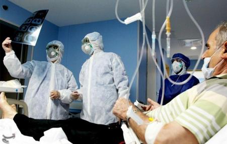 Doctors with a coronavirus patient in Iran.