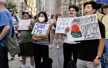 Photo of people rallying with signs like SAVE EPA.