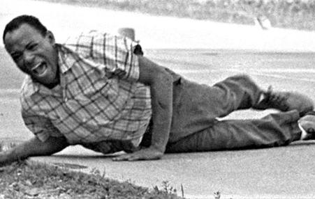 Civil rights activist James Meredith wincing in pain just after he was wounded by a sniper