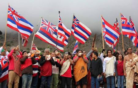 Maunakea protectors blow the Pū or conch shell to mark the ceremonial beginning of their protest.