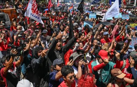 Protesters stage a demonstration to mark International Labour Day in Manila, the Philippines, on May 1, 2026