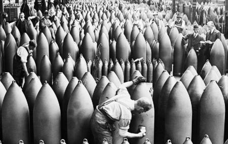 Photo of workers and supervisors in a munitions factory