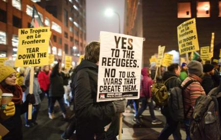 A march in support of refugees. 