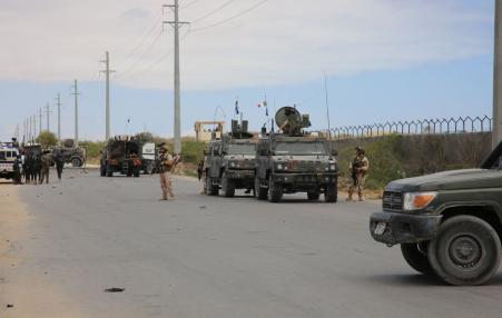 A road is blocked after al-Shabaab troops stormed an  American military base in Somalia.