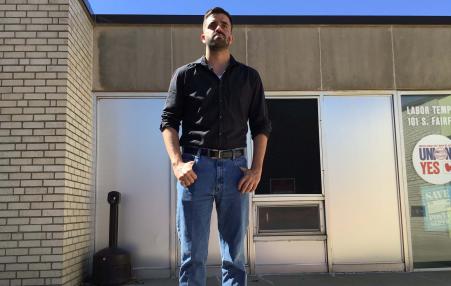 Man - Kooper Caraway - standing outside of the union offices.