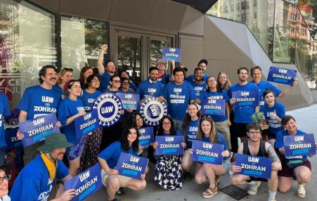 Photo of a large group of UAW members with Zohran. 