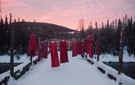 Hanging red dresses signify missing and murdered Indigenous women.