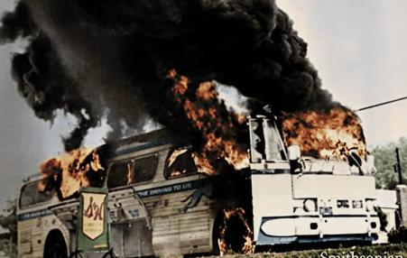 Freedom Riders bus aflame after having been firebombed near Anniston, Alabama