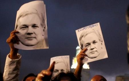 demonstrators with Assange photos