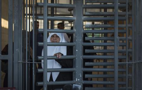 Paletinian woman at Isreali military checkpoint.