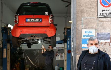 Italian mechanics pictured at their garage. 