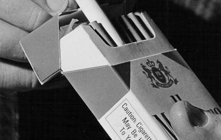 Photo of a pack of cigarettes and its health-hazard warning 