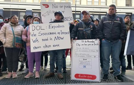 Workers holding signs such as DOL: Expedite the Statement of Interest