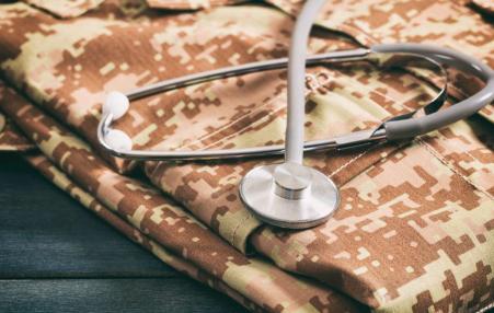 military fatigues and stethoscope