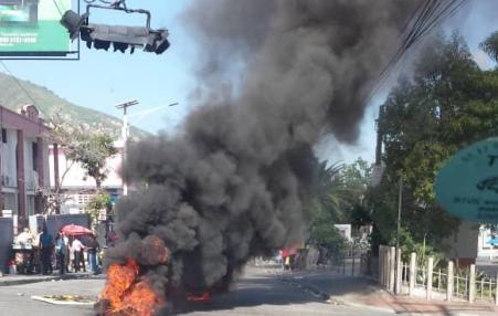 burning barricade in Haiti