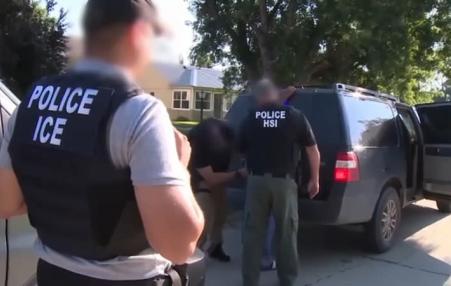 ICE agents arresting immigrant man