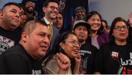 Photo of smiling people celebrating. 