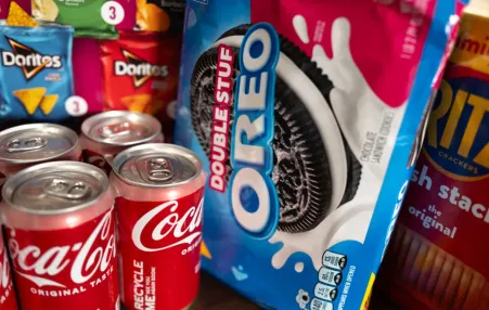 In this photo illustration, food products manufactured by Mondelez and Coca-Cola are shown on December 11, 2024 in Chicago, Illinois. 
